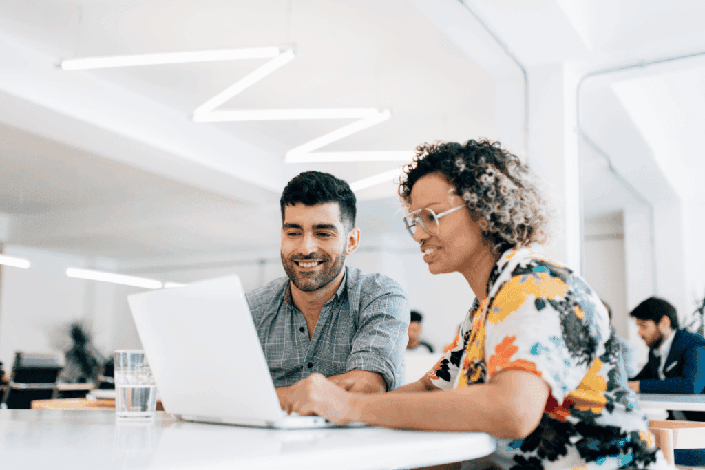 Two professionals discussing credit scores and financial strategies at a modern office.